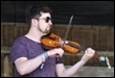 A person playing a violin

Description automatically generated with medium confidence