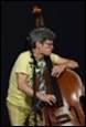 A person playing a double bass

Description automatically generated with medium confidence